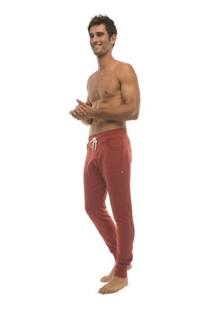 Long cuffed jogger and yoga sweat pants cinnabar red with white drawstring and side pockets for athletic use