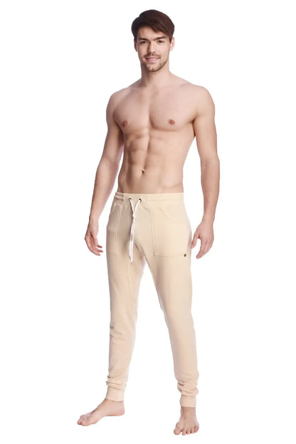 Beige long cuffed jogger and yoga sweat pants with drawstring waistband and side pockets for comfortable wear