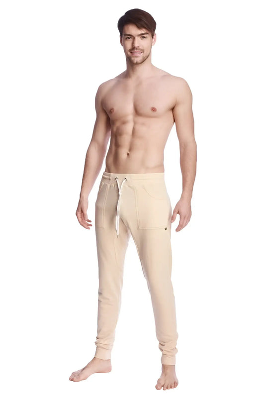 Beige long cuffed jogger and yoga sweat pants with drawstring waistband and side pockets for comfortable wear
