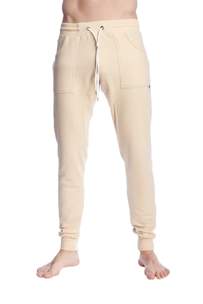 Cream-colored long cuffed jogger and yoga sweat pants in sand beige with drawstring waist and side pockets