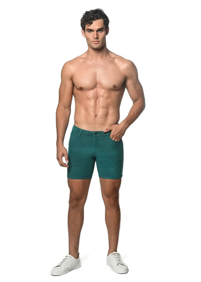 Teal-colored loopback stretch knit slim-fit denim shorts with five-pocket design and button closure