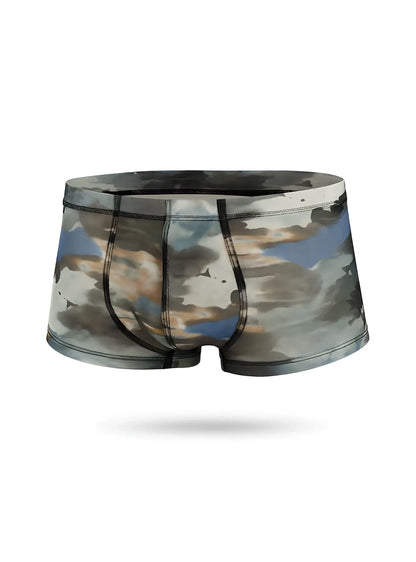 Luxury lace trunk men’s boxer briefs with soft watercolor sky and cloud pattern in muted blues grays and beige tones
