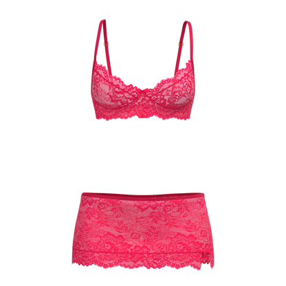 Fuchsia lace magic silk bra skirt and thong set featuring delicate floral lace and matching sheer skirt for elegant lingerie wear