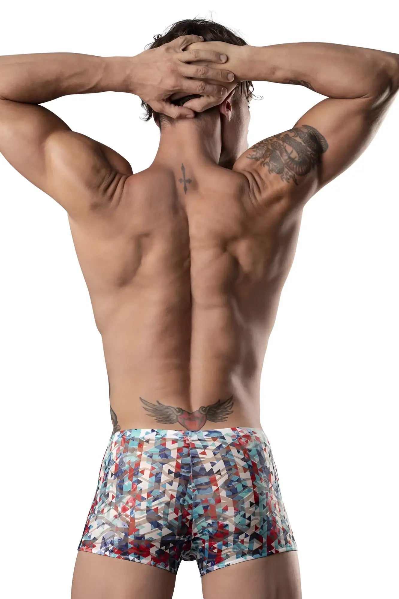 The man is wearing male power 131-293 pouch shorts with colorful red white and blue geometric patterns