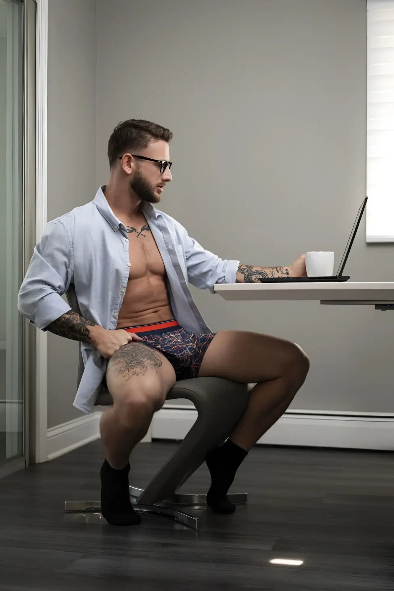 Man wearing navy male power 160-299 soo cumfy boxer briefs with red waistband showing front side details