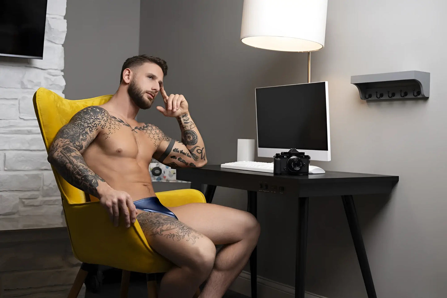 Black classic camera beside male power 442-301 liquid onyx 2.0 blue bong thong on desk