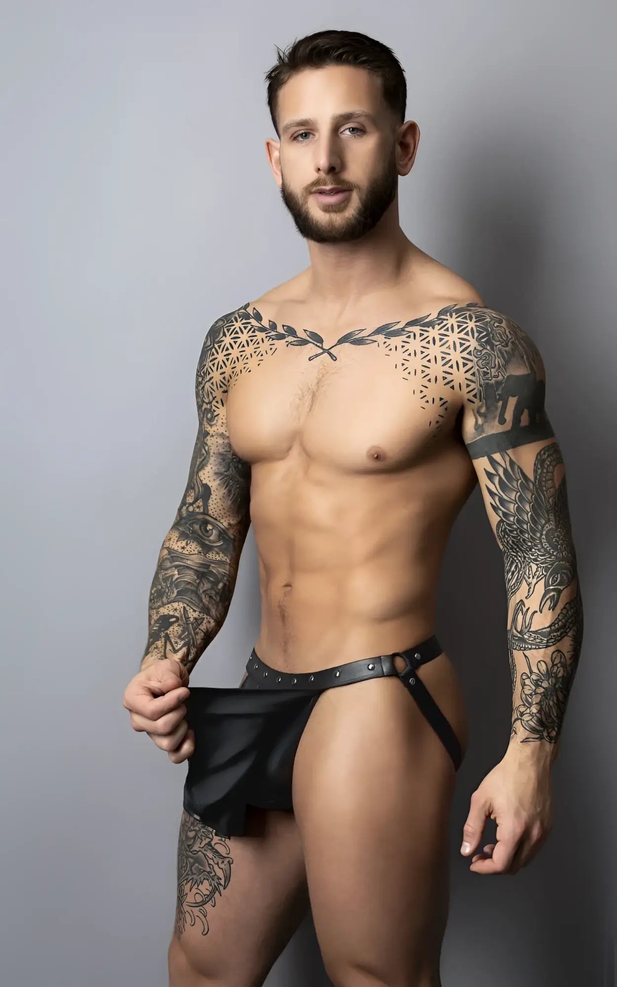 Black leather thong with silver studs and central buckle from Male Power PAK-158 fetish Spartacus in black
