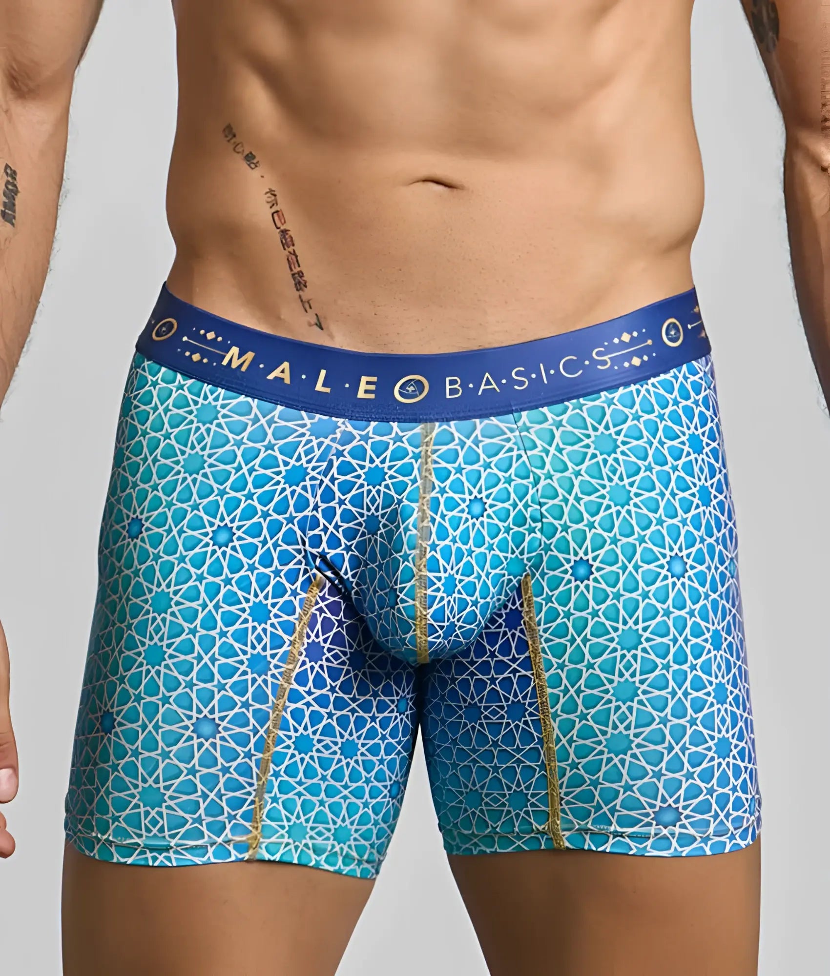 Blue patterned men’s boxer briefs with geometric design and gold trim from malebasics hipster collection