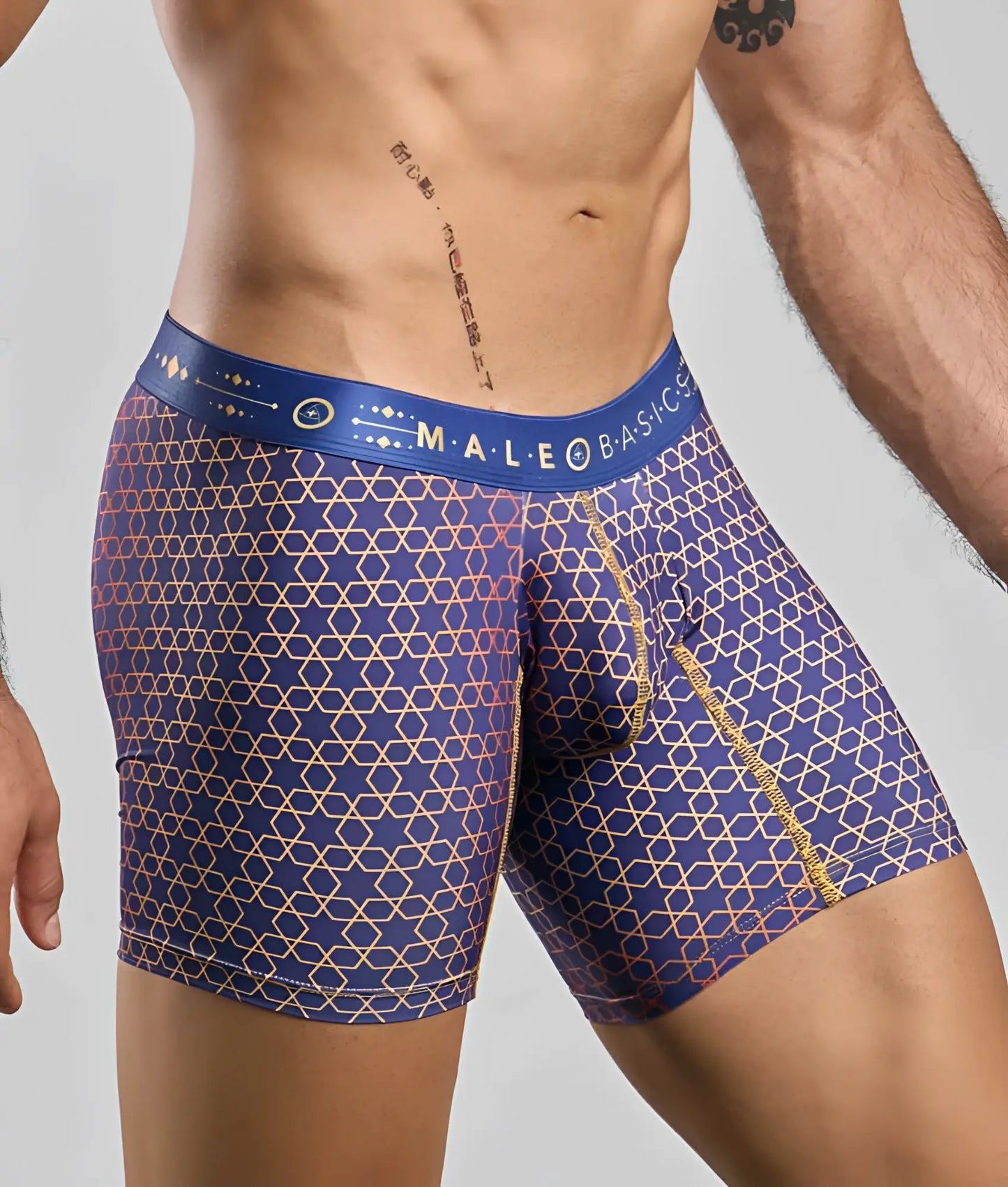 MaleBasics boxer brief hipster men’s underwear in blue with gold and pink geometric pattern and branded waistband