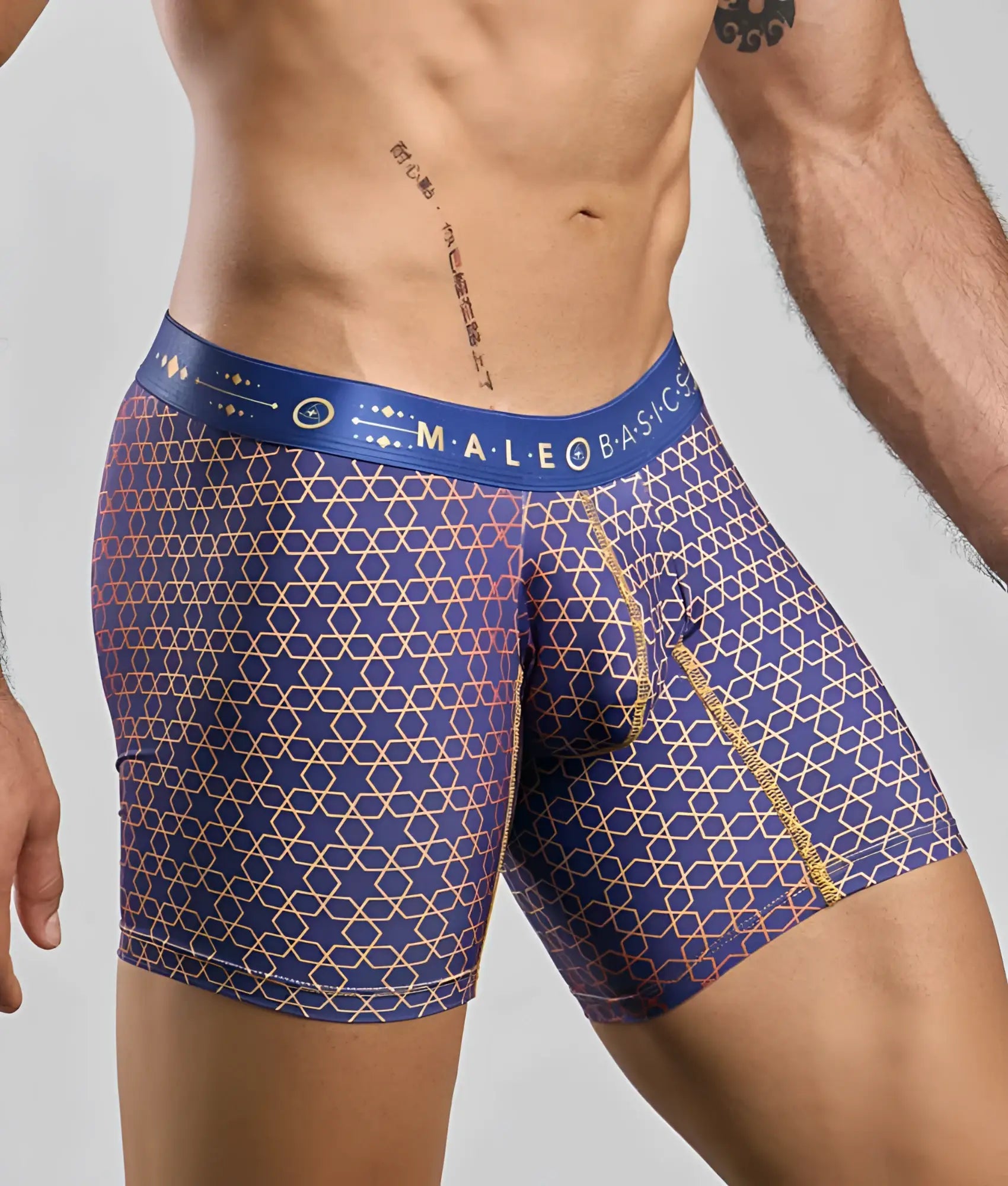 MaleBasics boxer brief hipster men’s underwear in blue with gold and pink geometric pattern and branded waistband