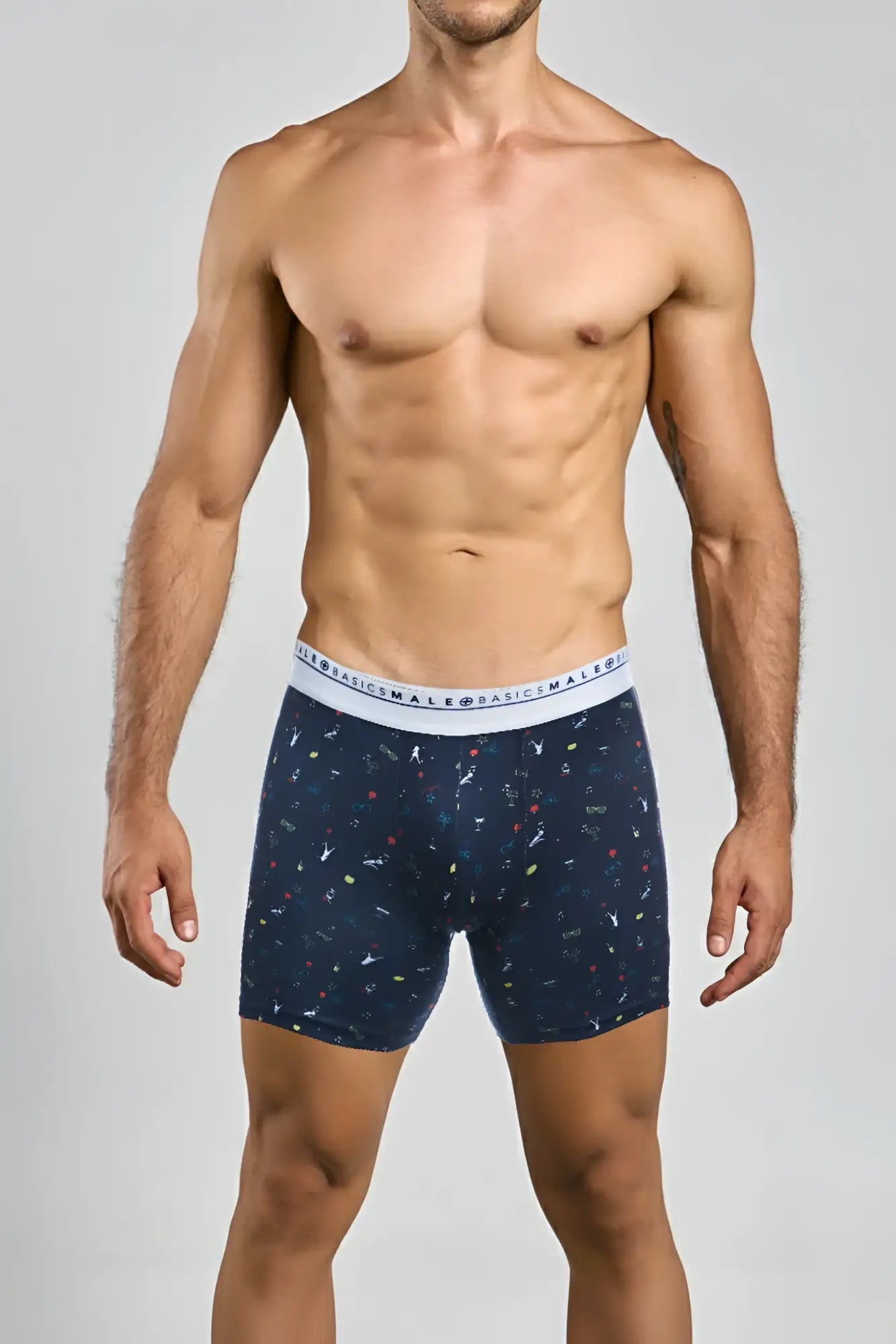 Navy blue malebasics boxerbrief party with colorful abstract pattern and white elastic waistband with basics male text