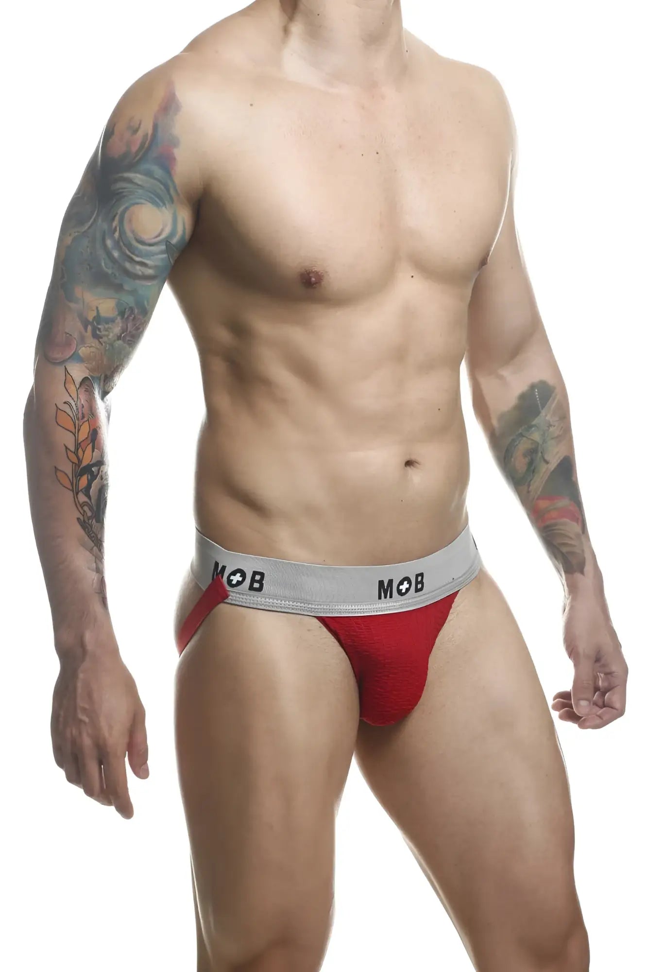 Red athletic briefs with a gray waistband featuring the mob logo from malebasics mb107 classic fetish jockstrap