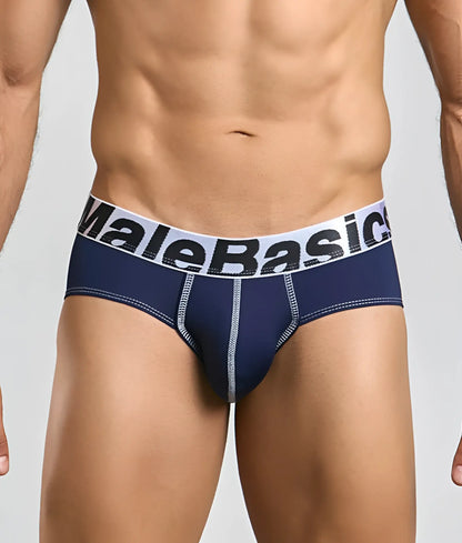Navy blue MaleBasics microfiber briefs with white elastic waistband, black lettering, and light gray stitching along seams
