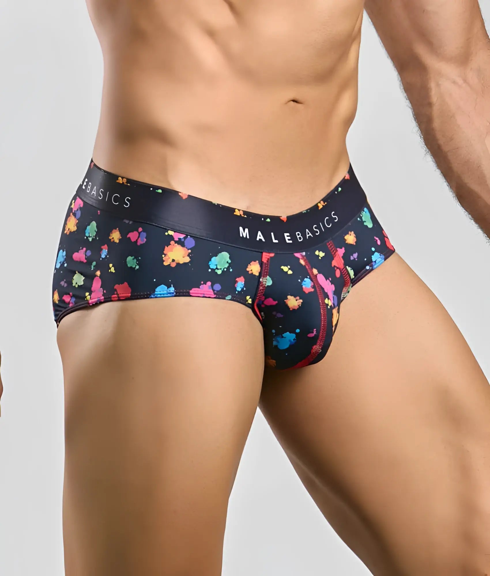 Black malebasics hipster briefs with vibrant multicolored paint splatter pattern and branded waistband