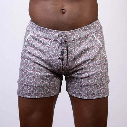Gray and white mandala linen texture shorts with circular floral design and side zipper pockets for swimwear use