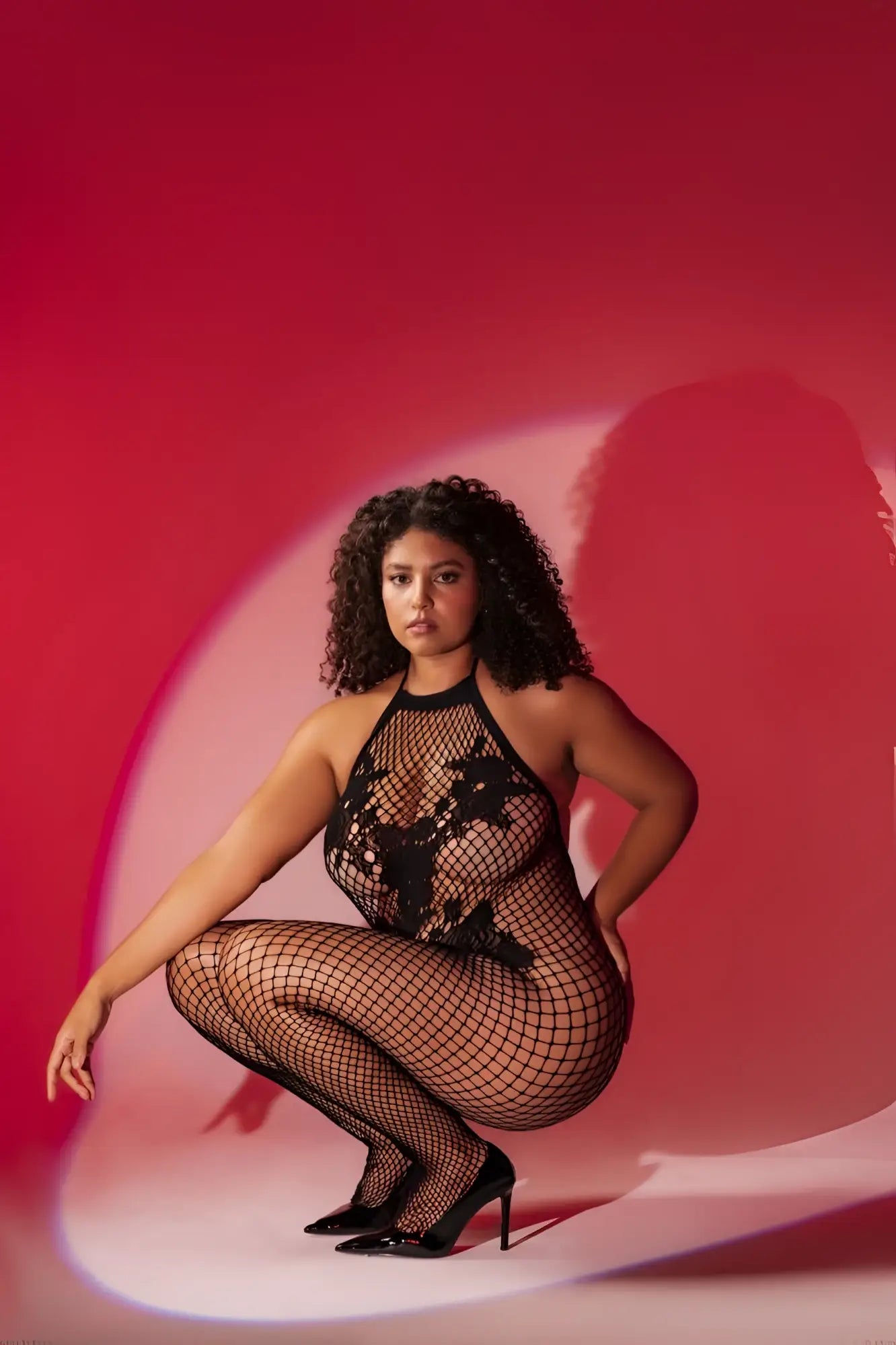 Black fishnet halter and crotchless bodystocking with floral lace detailing by Mapale in color black