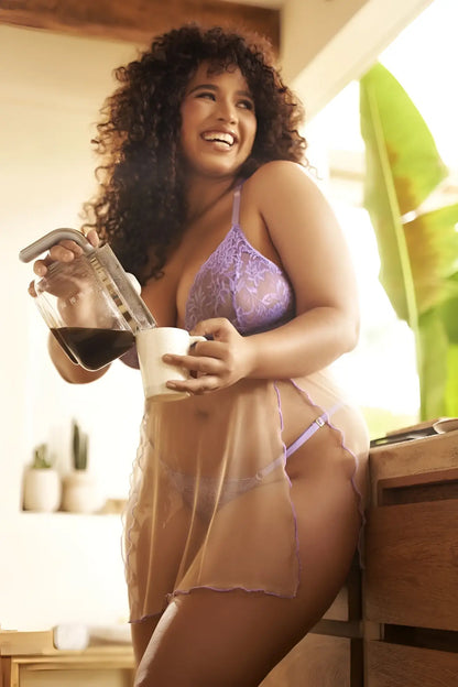 A woman wearing mapale 7540X verona babydoll sheer lavender lace lingerie set with matching thong and bra
