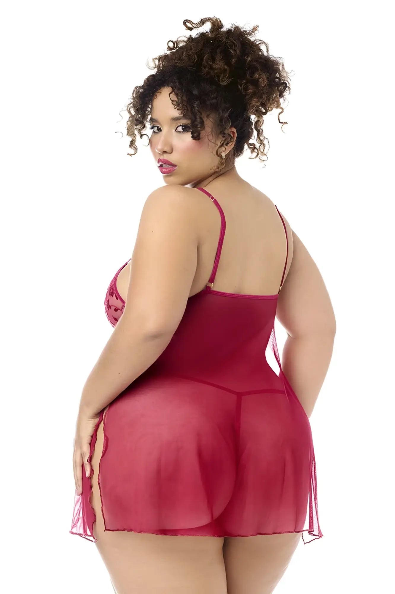 A plus-size woman wearing a sheer deep red mapale 7620x babydoll lingerie dress with lace bodice and matching panty