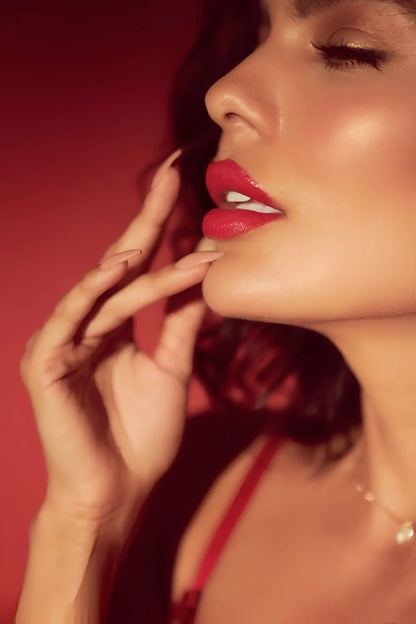A woman’s lips with vibrant red lipstick showcasing the mapale 8899 two piece set in black and red colors