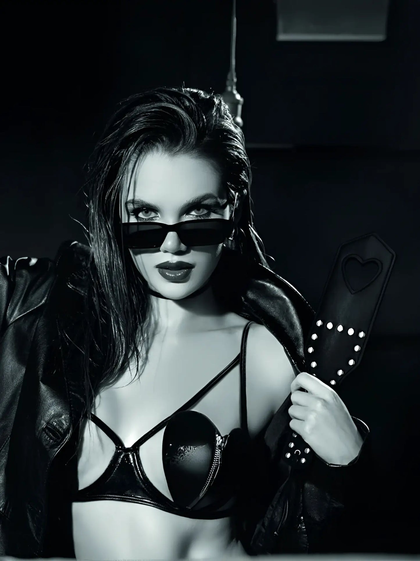 Black leather paddle with heart shaped handle and silver studs from mapale 998 spanker collection