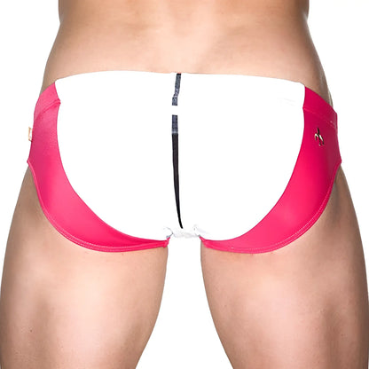 Back view of marcuse ma bondi swim trunks in bright pink and white with black zipper detail
