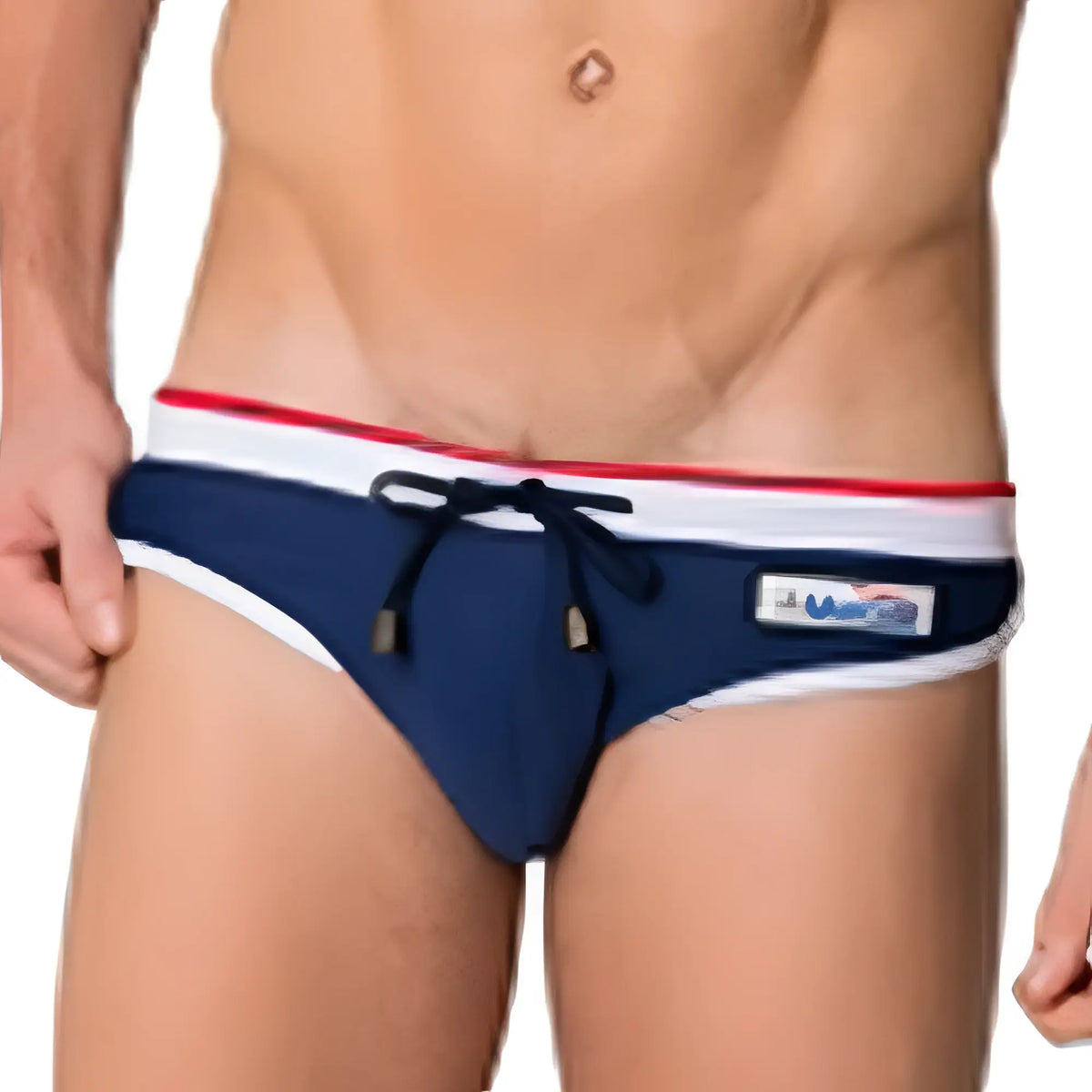 Navy blue Marcuse MA Cargo23 swim trunks with red and white striped waistband and black drawstring ties