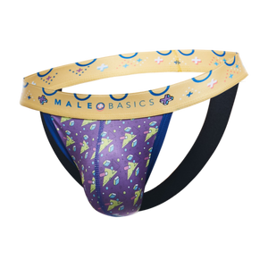 A men's thong-style brief from MaleBasics featuring a purple front pouch with a colorful space-themed print of planets, stars, and crystals, a beige waistband with blue crescent moons and stars, and a black elastic back support strap, shown on a plain white background.