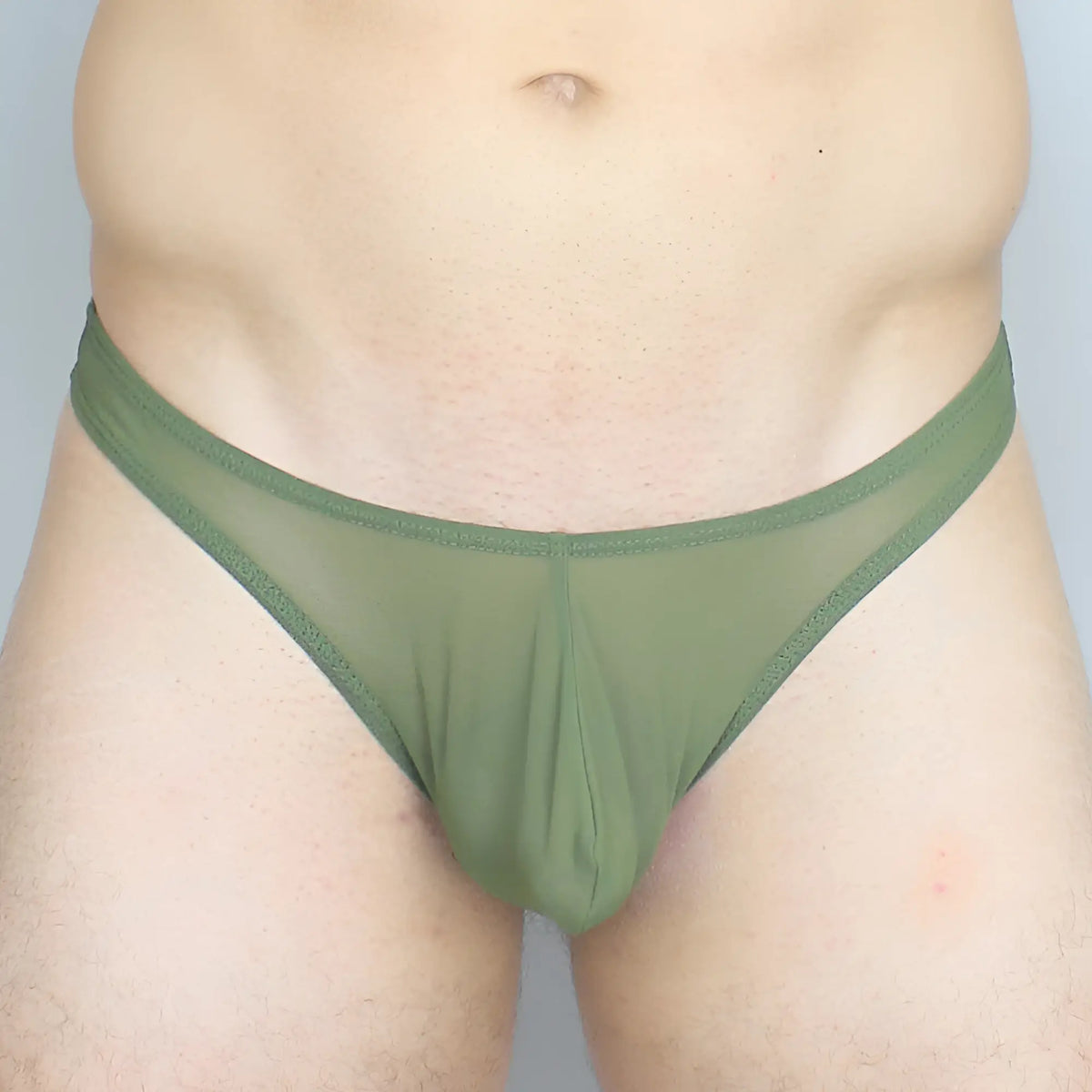 Mckillop GGUS Gravity Enhance thong in olive green sheer mesh with a solid fabric waistband shown from the back