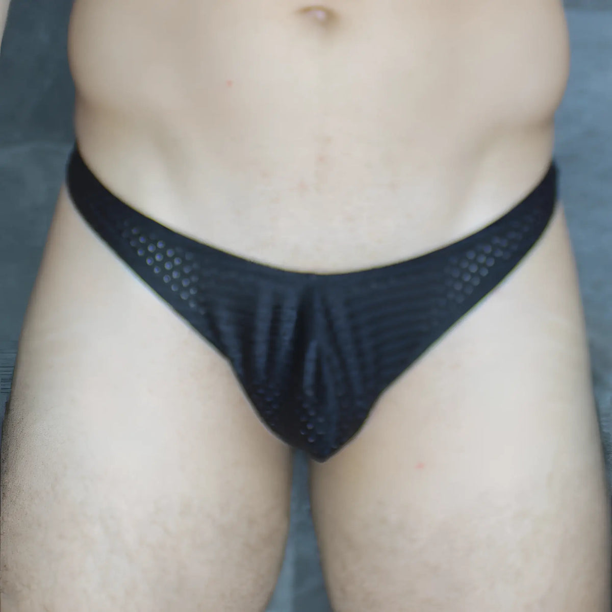 Black mesh briefs mckillop mckvtpl thong with breathable textured fabric and a snug fit shown from the back side