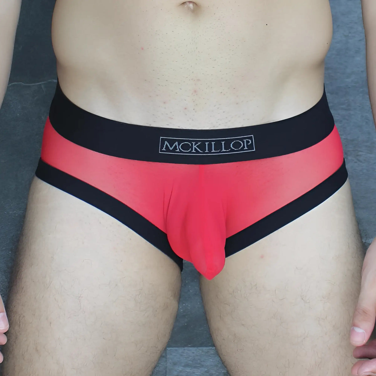 Red and black mckillop obus hoist brief ultra mesh featuring sheer mesh fabric for breathable support
