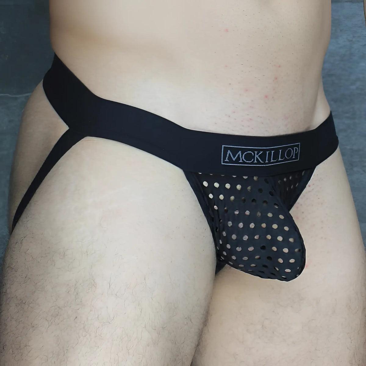 Black mckillop mesh briefs with a solid waistband and perforated front panel in lycra from mckillop ojhq hoist jock glory