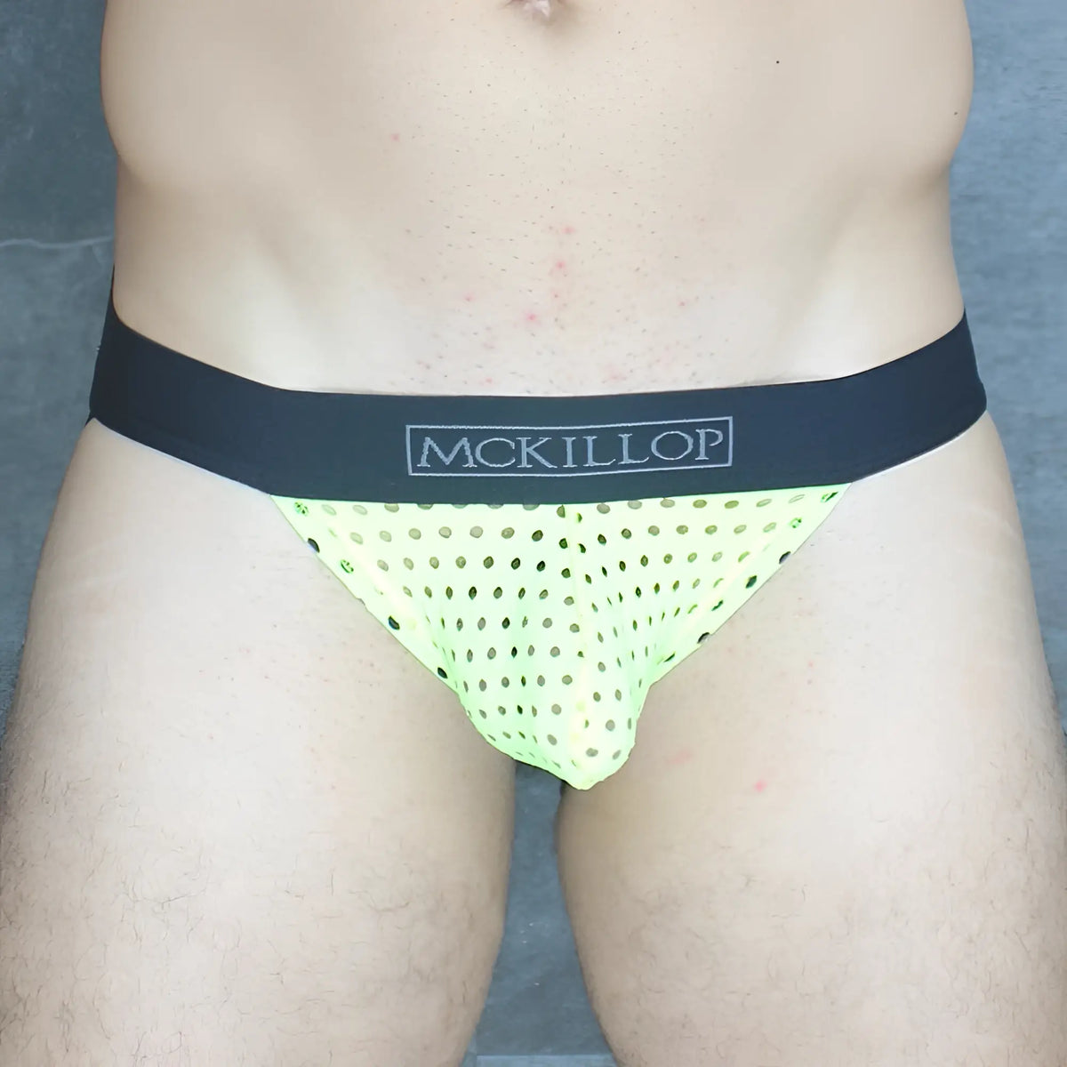 Mckillop ojhq hoist jock glory lycra neon green perforated mesh briefs with black waistband and mckillop branding