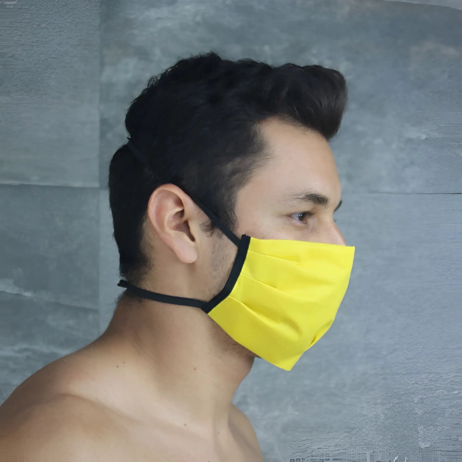 Bright yellow mckillop polypropylene unisex face mask with black elastic ear loops size one size