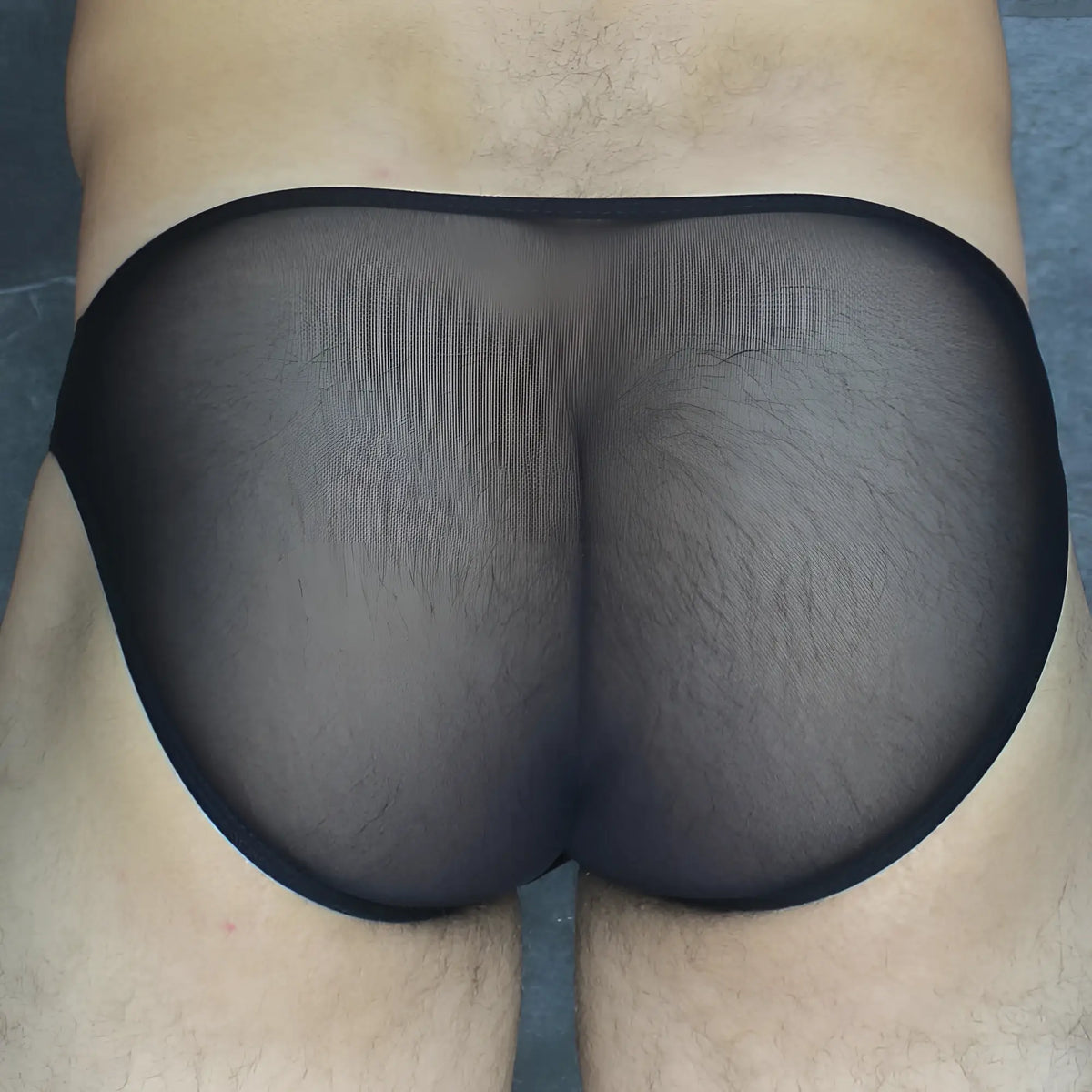 Black sheer mesh briefs with a solid black elastic waistband from Mckillop VKUS Hoist bikini ultra mesh collection