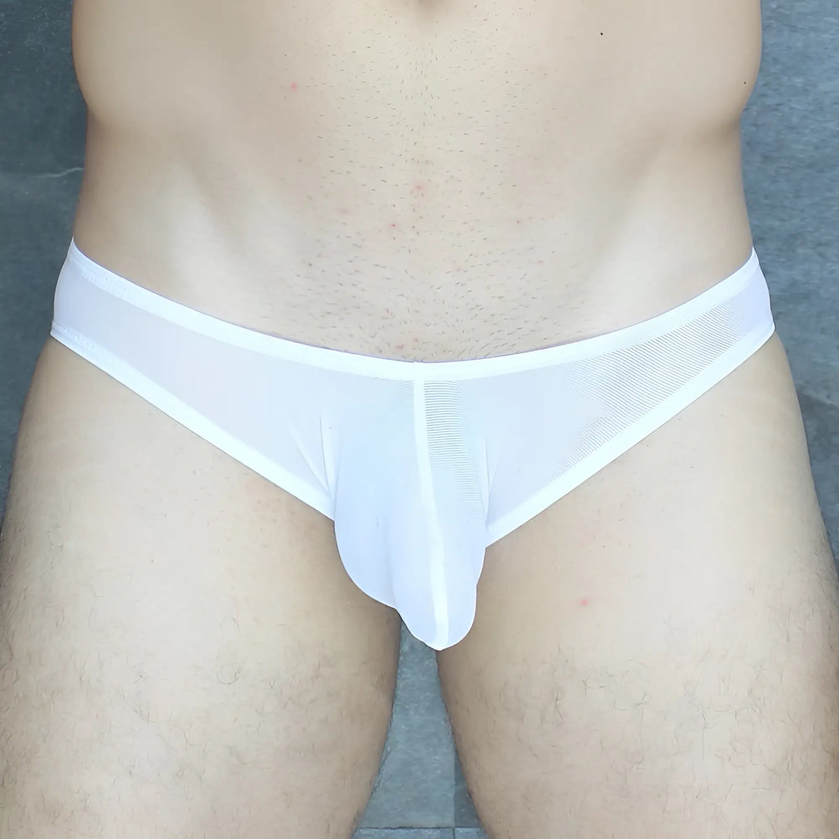 White mesh briefs with solid white waistband and front panel from the mckillop vkus hoist bikini ultra mesh collection