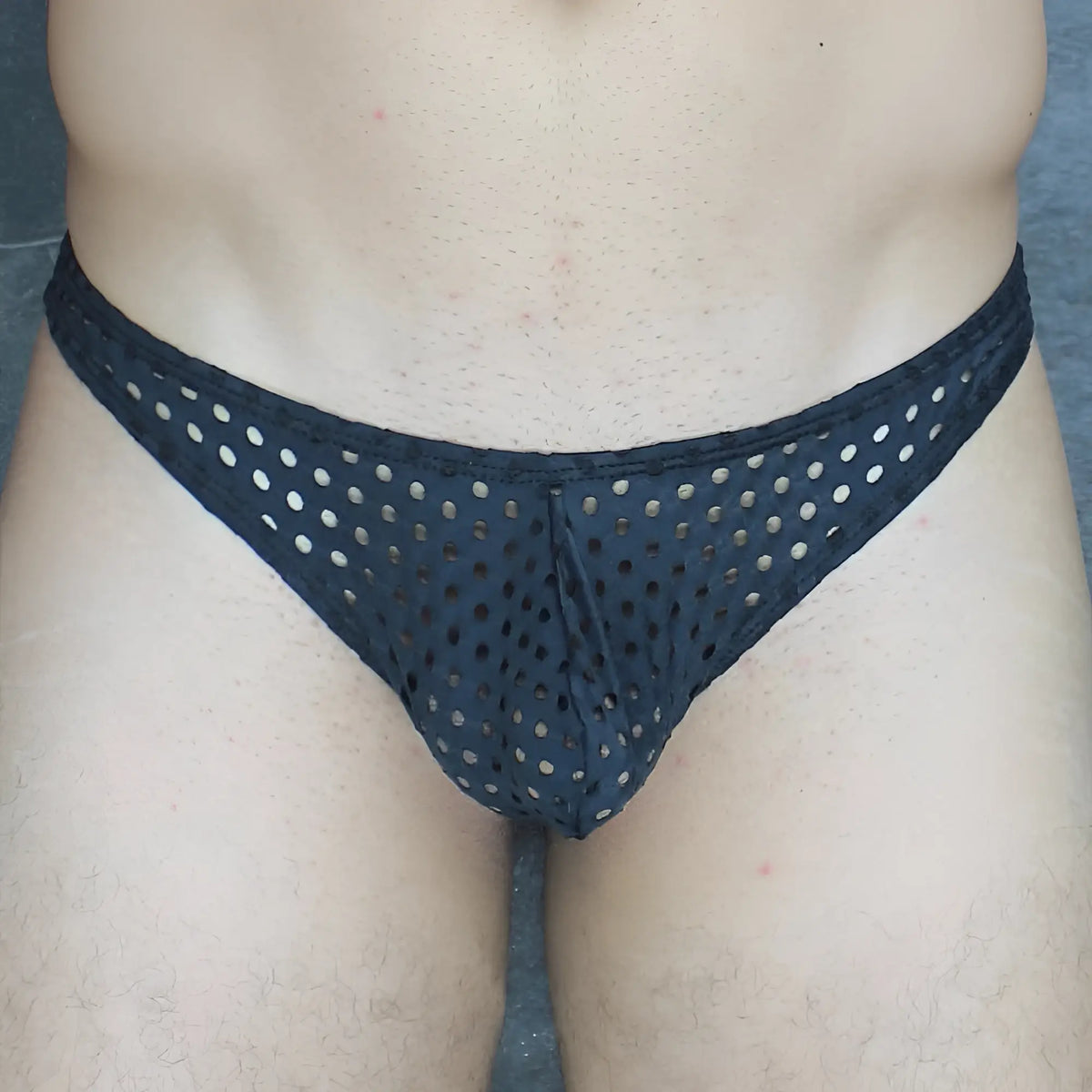 Black mckillop vthq hoist thong glory lycra mesh briefs with evenly spaced circular holes visible from the front