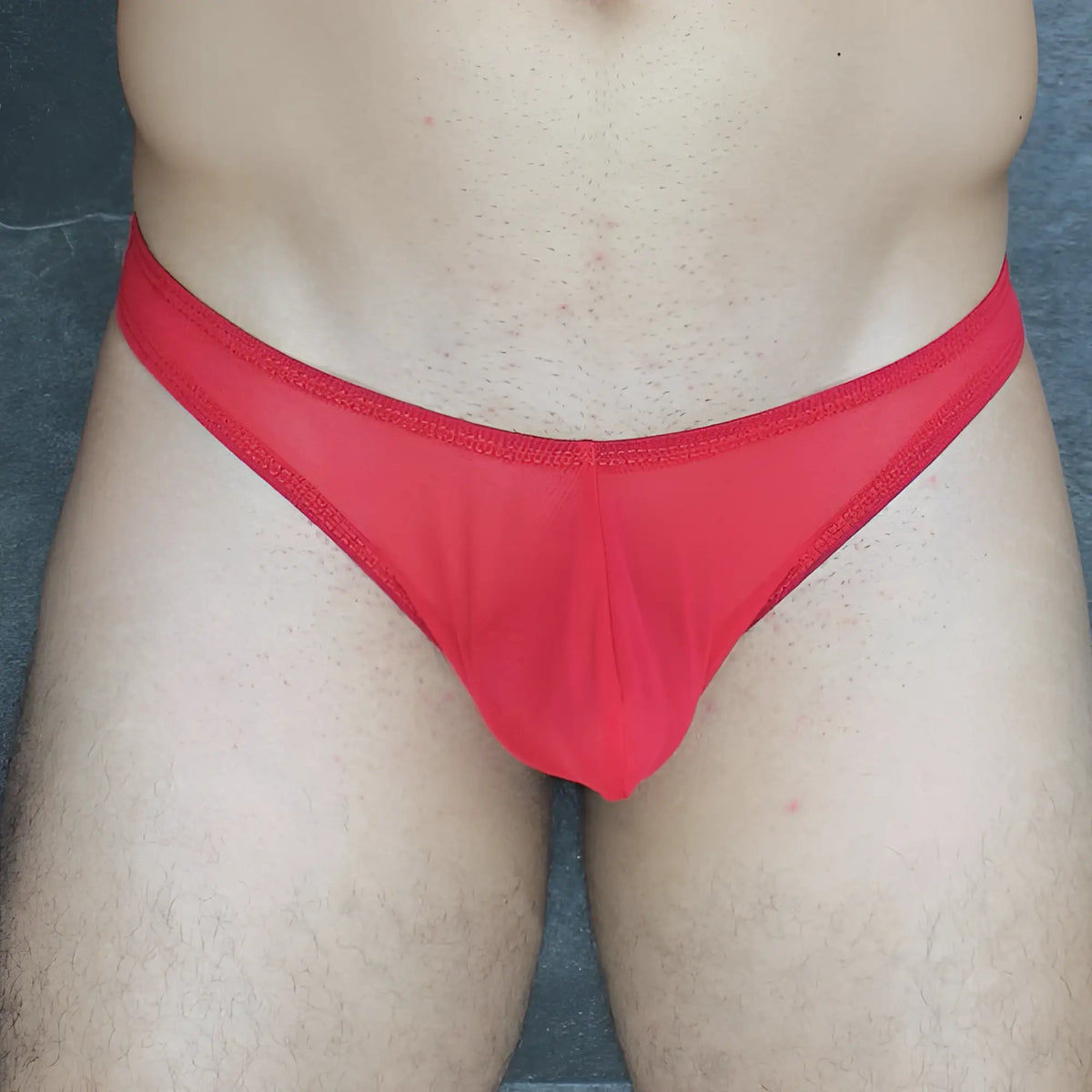 Red sheer mesh thong with solid red waistband from mckillop vtus hoist thong ultra mesh collection