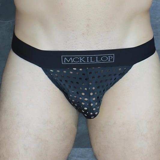 Black mckillop thong brief with perforated mesh design and solid elastic waistband in glory lycra fabric