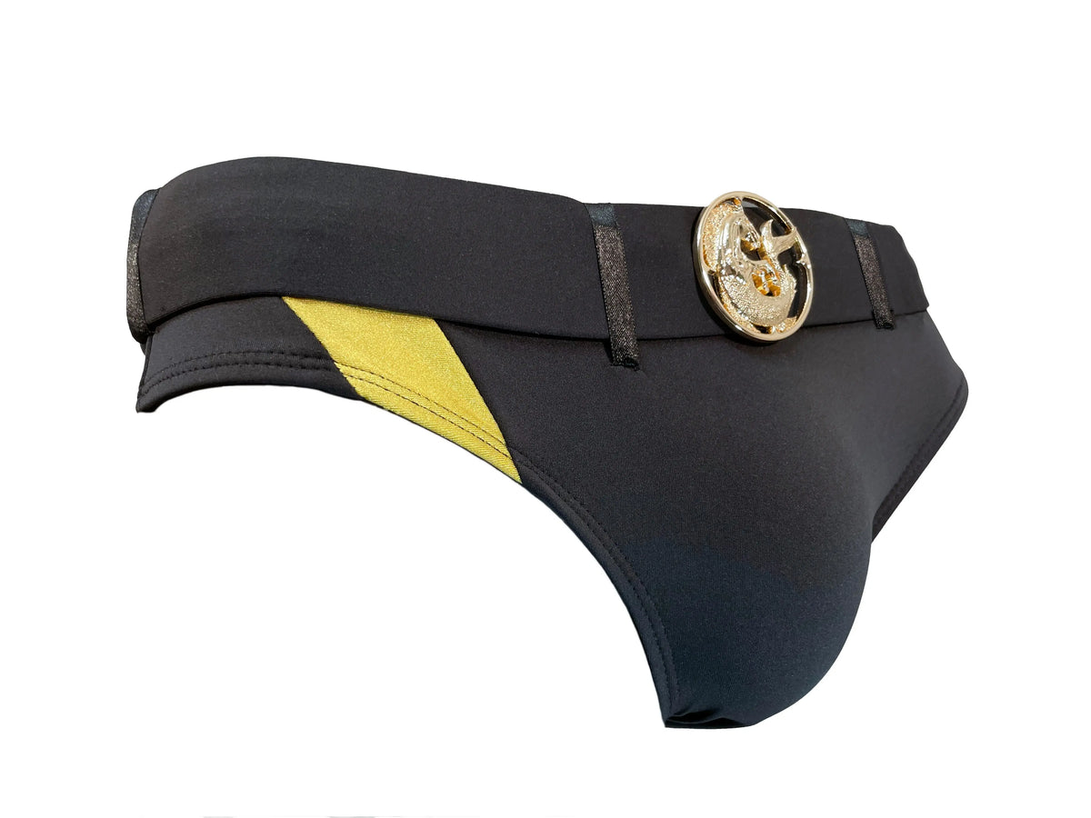 Black swim briefs with gold medallion detail and yellow side panel made by Maris Equi featuring a sleek design.