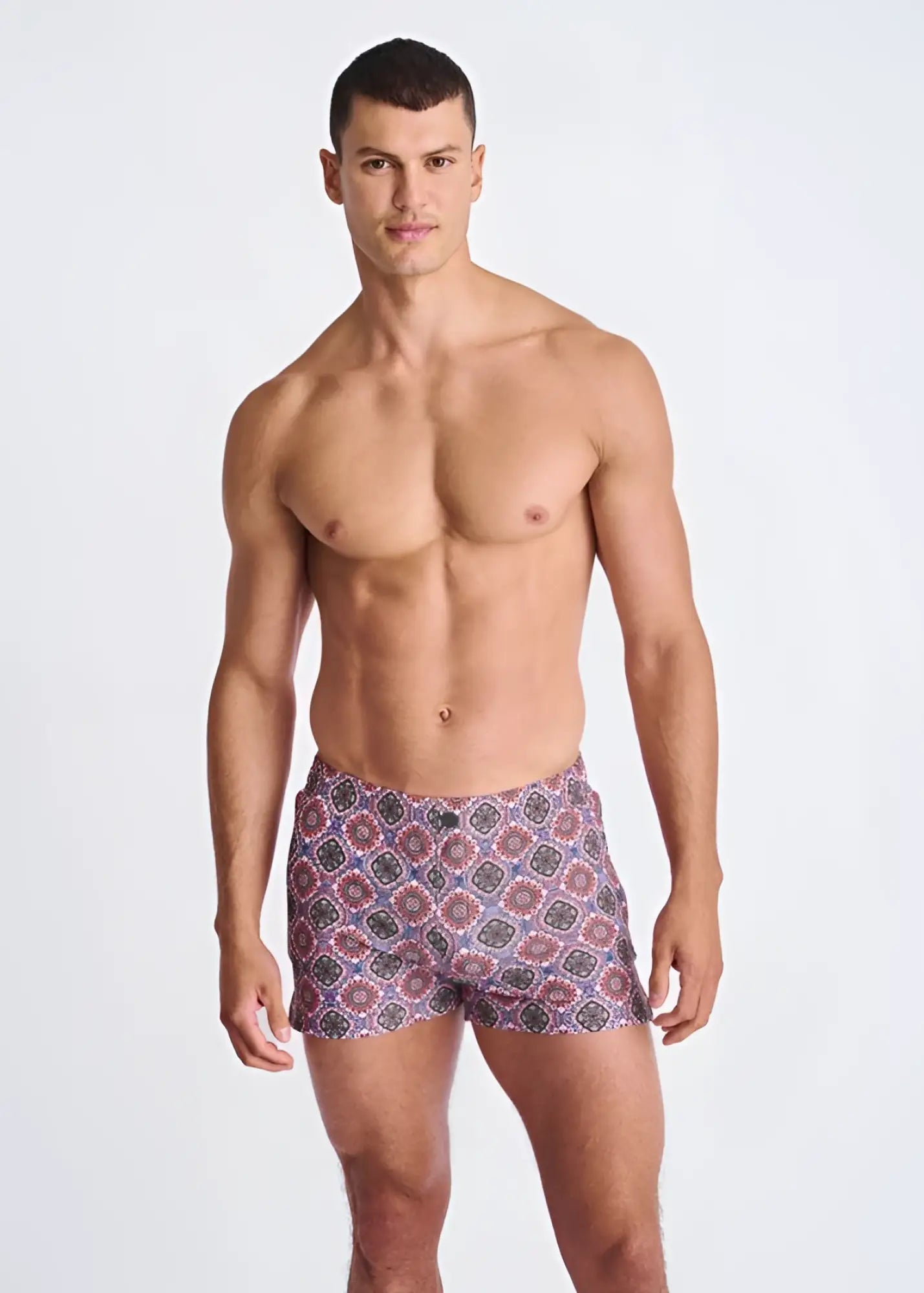 Medallions seersucker swim shorts with mesh lining featuring vibrant purple red and blue geometric patterned fabric