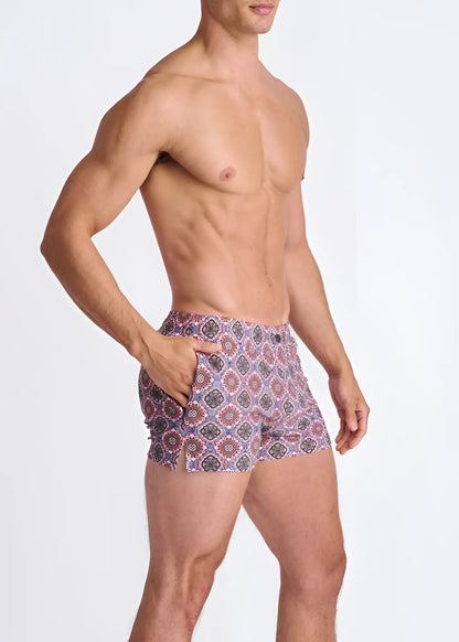 Medallions seersucker swim shorts with mesh lining in vibrant purple red and gray geometric patterned design