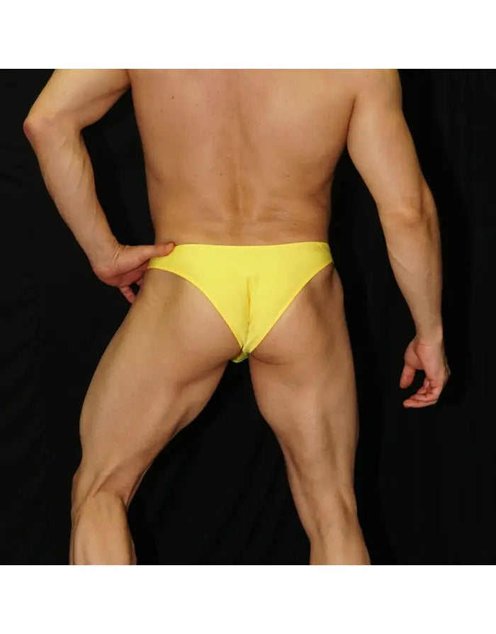 Yellow micro bikini underwear by Arroyman featuring a snug fit and minimal coverage shown on a model from the back.