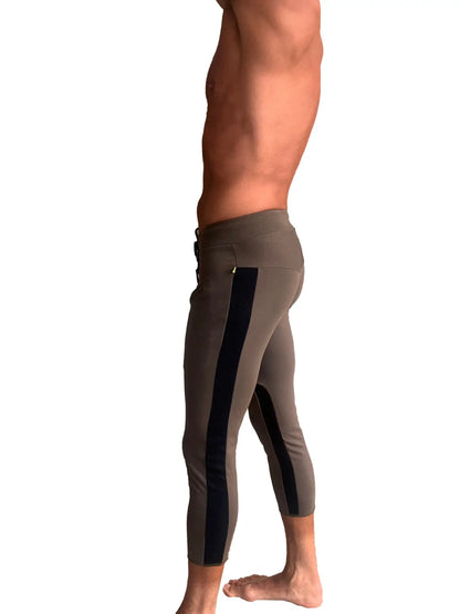 Mens army green capri yoga pants with black vertical stripes and high-waisted design for athletic use