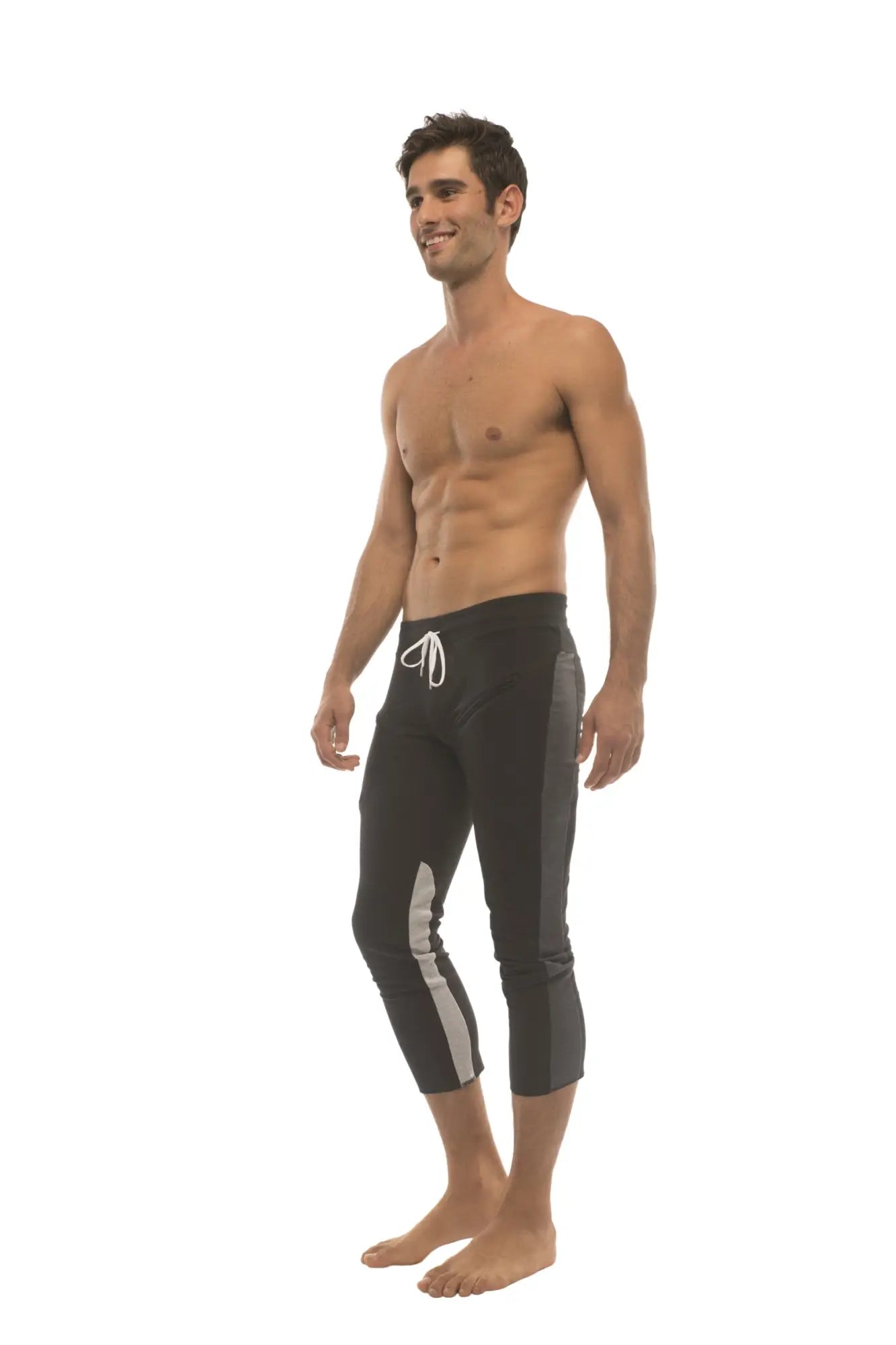 Mens black capri-style swim trunks with white drawstring gray side stripes and zipper pockets for active use