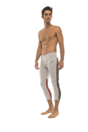 Mens 4/5 zipper pocket capri yoga pants in white with gray and red side stripes and a drawstring waistband