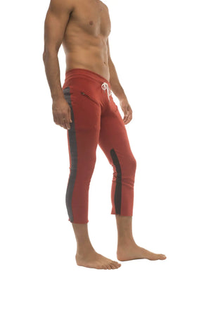 Mens 4/5 zipper pocket red capri yoga pants with black side stripes and white drawstring waistband