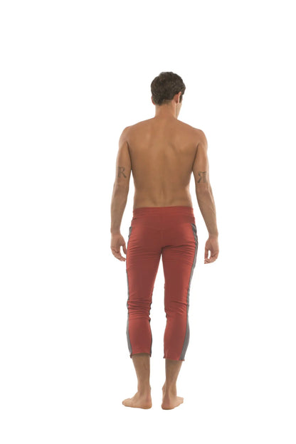 Mens 4/5 zipper pocket capri yoga pants in red with charcoal gray side panels designed for comfort and flexibility
