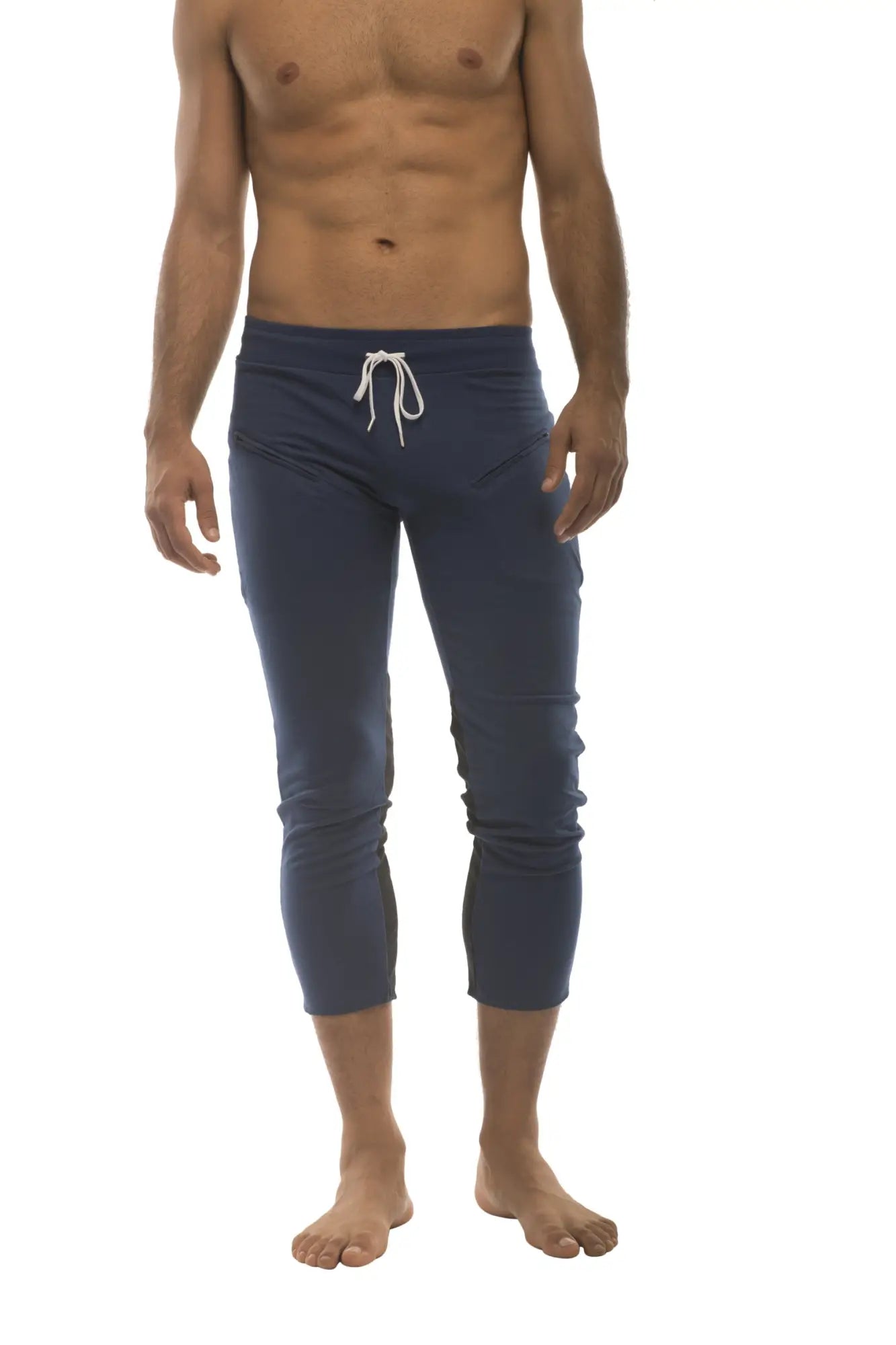 Mens navy blue capri yoga pants with white drawstring waistband and 4 5 zipper pockets for athletic use