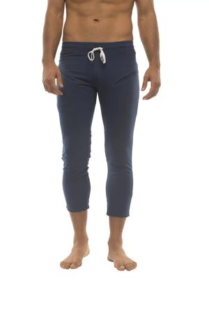 Mens solid royal blue 4/5 zipper pocket capri yoga pants with navy blue fabric and white drawstring waistband