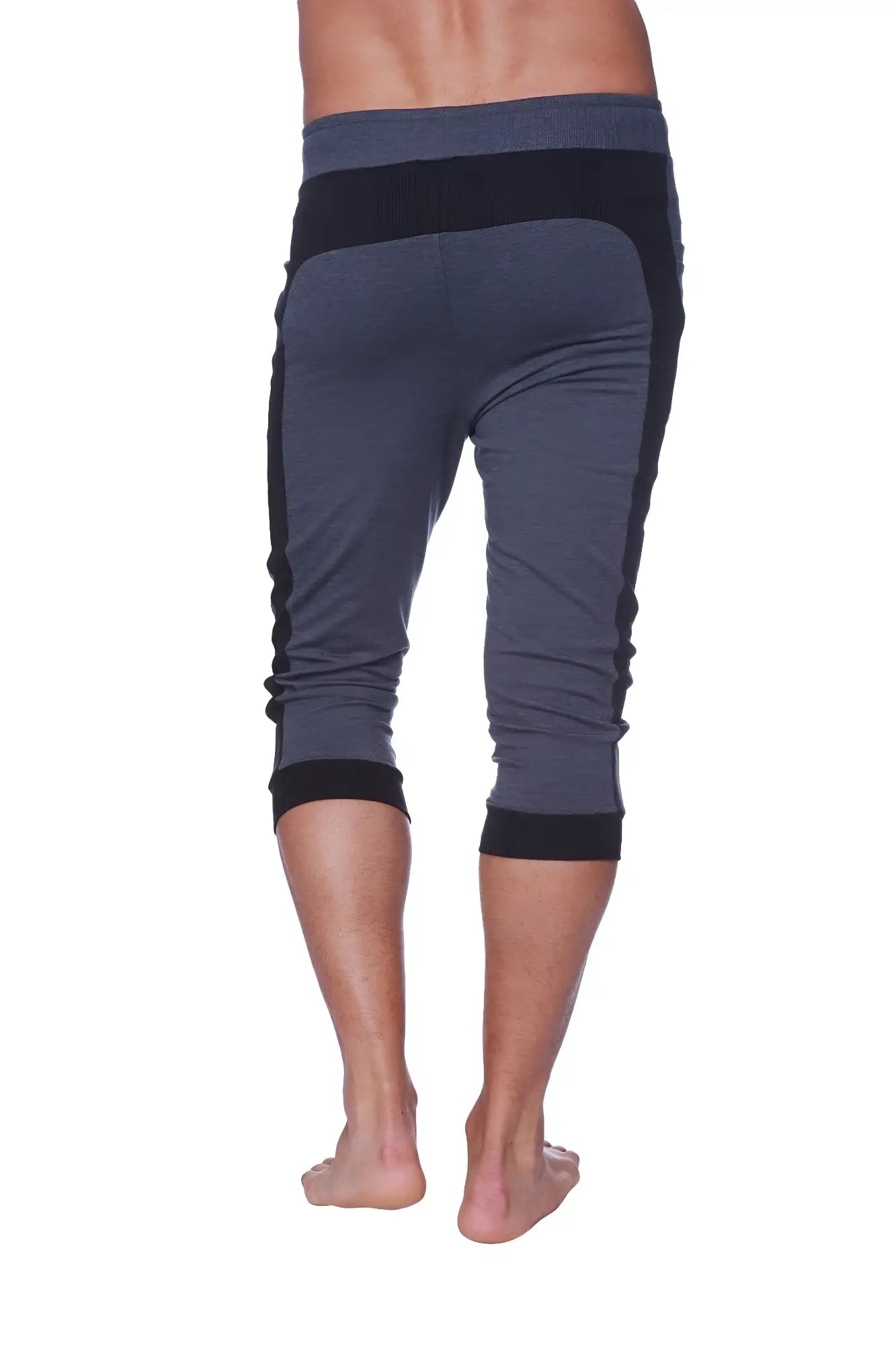 Mens cuffed yoga pants in dark gray and black with ribbed waistband and cuffs for athletic wear